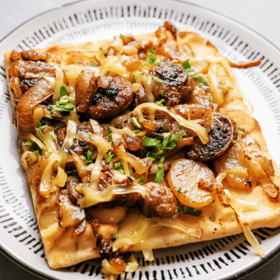 Bratwurst and caramelized onion flatbread made with READ German Potato Salad